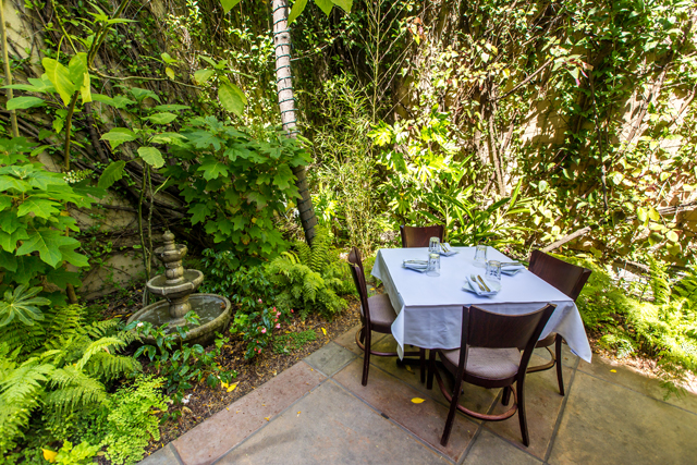 A view of the lush garden patio at Laili's. 