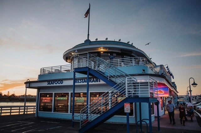 Storefront of Stagnaro Bros Restaurant on the Santa Cruz Wharf during sunset
