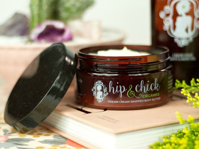 Body butter in a brown container with their logo on the front with the description " Dream Cream Whipped Body Butter"