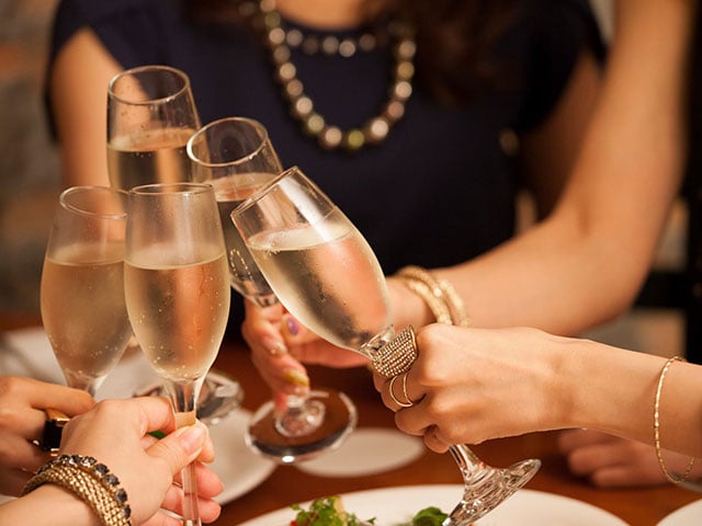 Clicking champagne glasses for New Year's