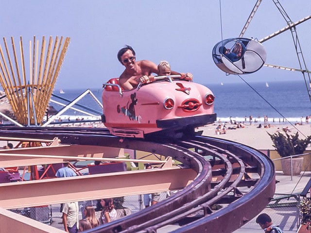 SC Boardwalk black and white image of wild mouse ride, man & child on the ride