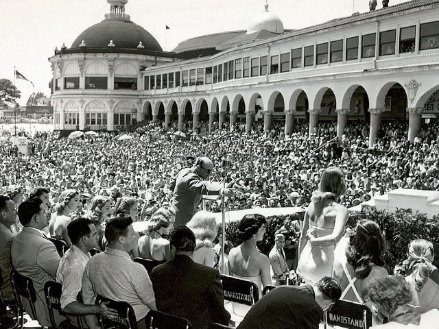 SC Boardwalk black and white image of miss california contest, large crowd on beach