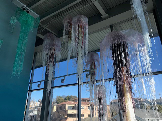 Jelly fish installation made by the JellyGirls of Fusion Glass Co. Made out of donated plastic painter tarps, grocery bags, VHS tapes and salvaged plastic wrap. 