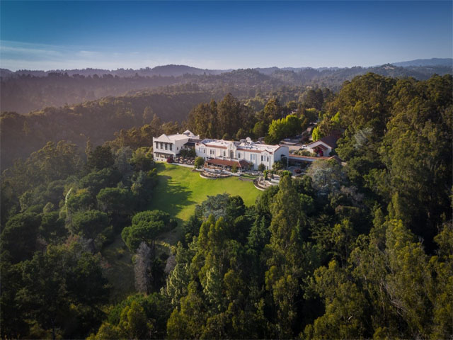 Aerial view of Chaminade Resort & Spa that sits on a mountain top surrounded by redwoods