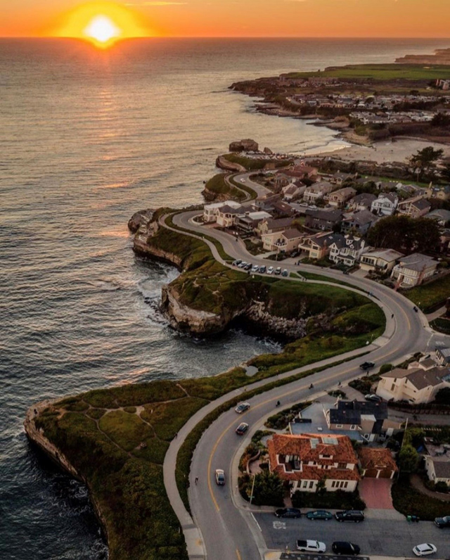 Best of 2021: This Photo is one of the top posts for 2021 on the Visit Santa Cruz County Social Media Channels. This photo is of a sunset over West Cliff Drive by aerial view. Photo by Ben Ingram Visuals.