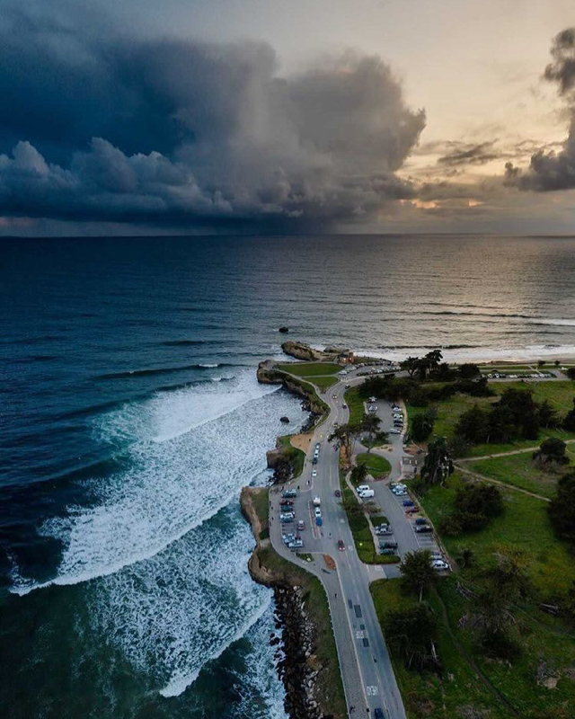 Best of 2021: This Photo is one of the top posts for 2021 on the Visit Santa Cruz County Social Media Channels. This photo is of a moody day over West Cliff Drive by aerial view. Photo by Ben Ingram Visuals.