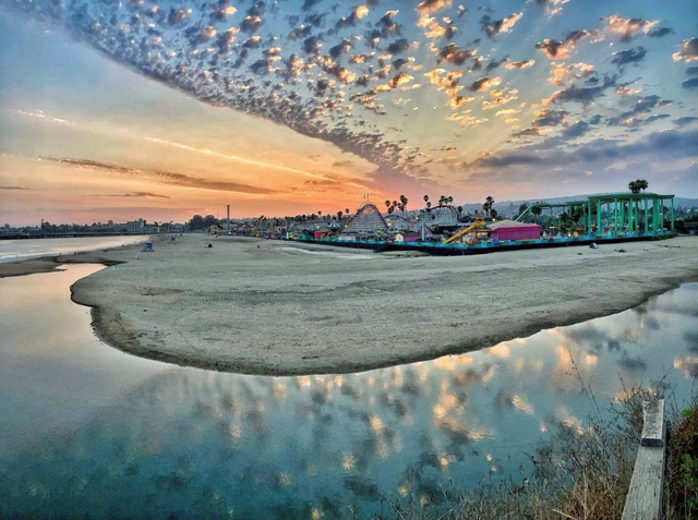 Best of 2021: This Photo is one of the top posts for 2021 on the Visit Santa Cruz County Social Media Channels. This photo of a gorgeous sunset over the Santa Cruz Beach Boardwalk with lots of clouds. Photo by SummerStar_.