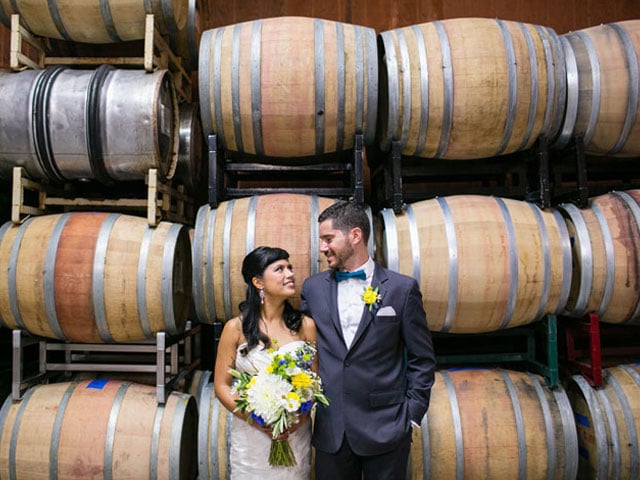 Couple glancing at each other at Bargetto Winery 