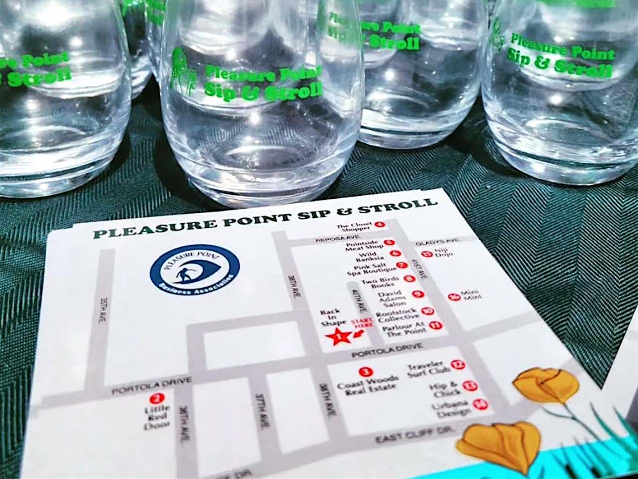 Commemorative glasses and a map of participating shops