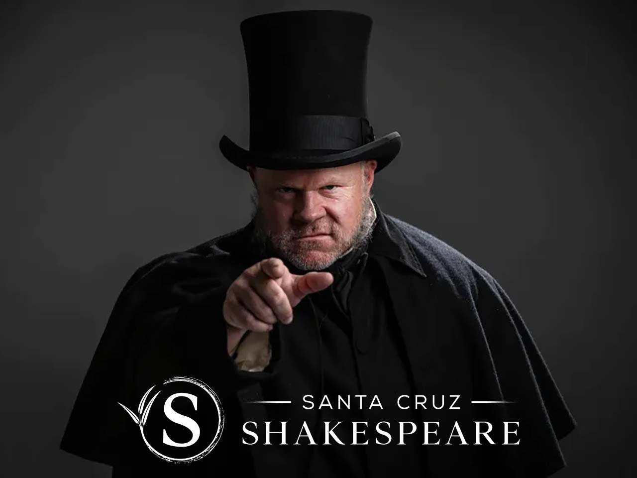 Scrooge frowning and pointing his finger over the Santa Cruz Shakespeare logo