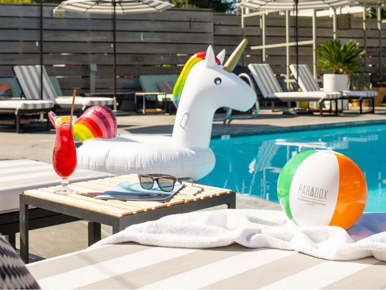 Paradox hotel pool toys floating in the pool.