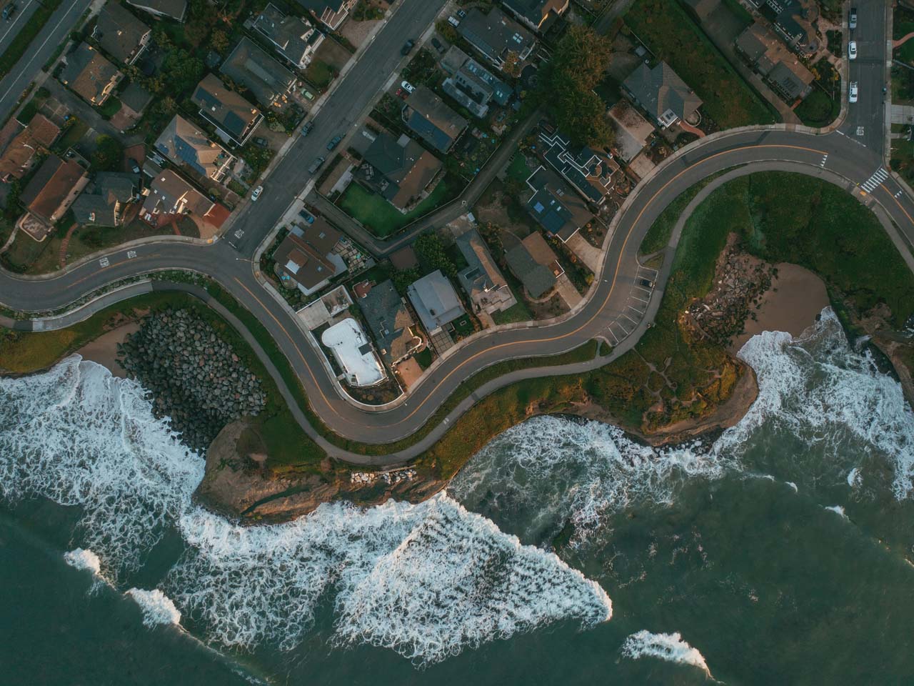 Overhead view of waves crashing close to West Cliff Drive