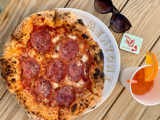 Pizza and beverage at Mentone restaurant in Aptos. Photographed by Monica Multer