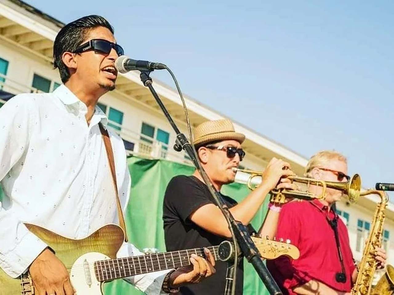 Band with horns playing in front of the Crow's Nest