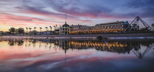 View of the Boardwalk colonnade from the beach during sunset. Photographed by Ben Ingram