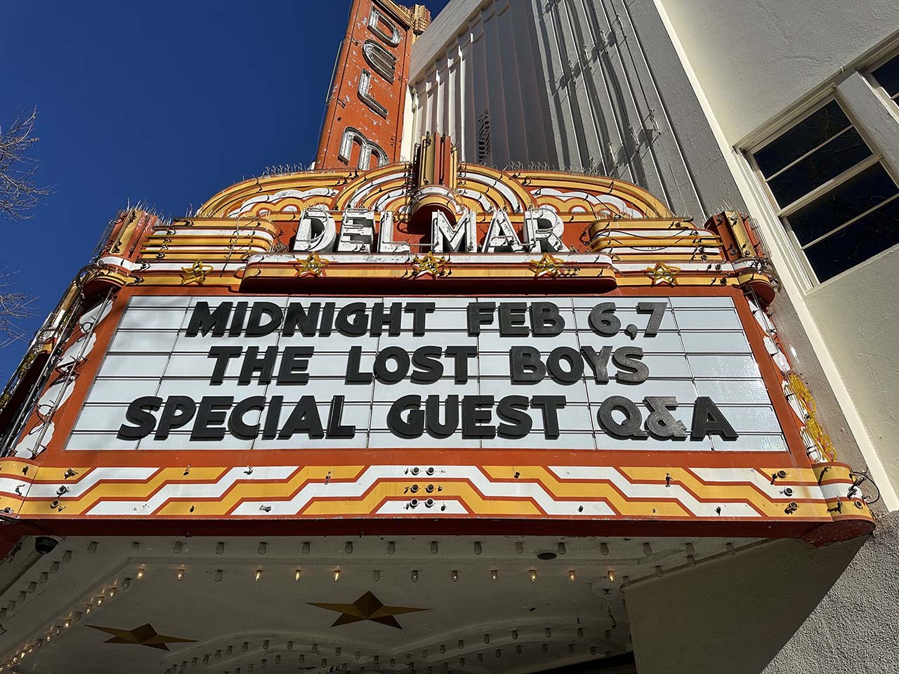 Marquee of a fancy movie theatre showing the Lost Boys showing February 6 and 7