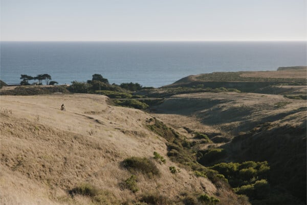 An individual dirt biking at Cotoni Coast Dairies. Photographed by Ben Ingram