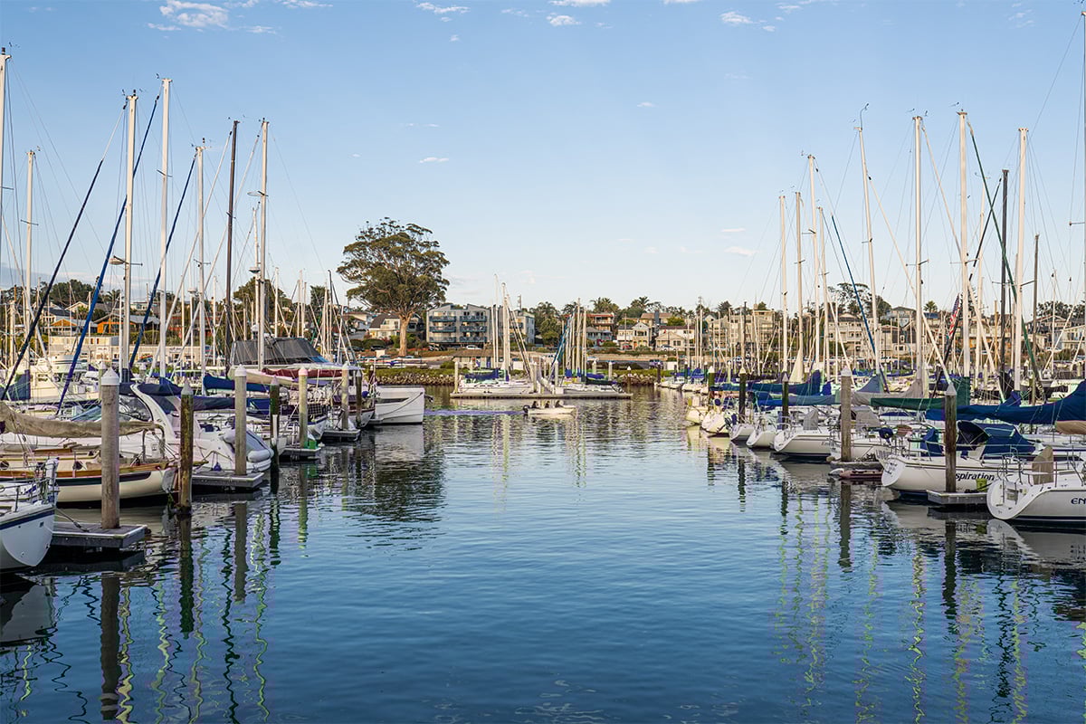 View of a line up of boats docked at the harbor. Photographed by Liz Birnbaum, The Curated Feast
