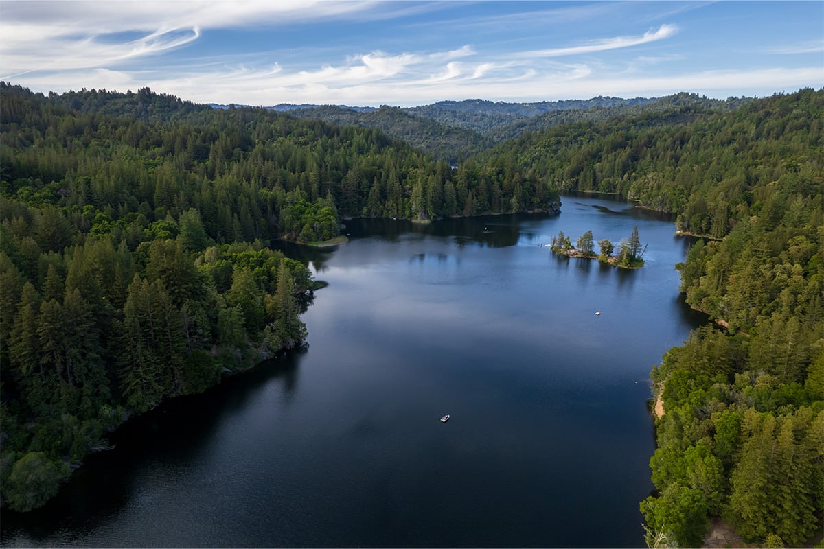 Aerial shot of a rowboat at Loch Lomond. Photographed by Daniel Gorostieta
