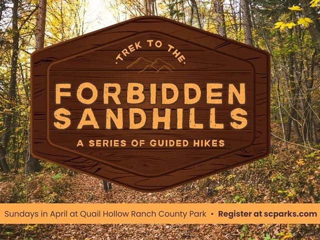 A sign blocking a trail saying forbidden sandhills