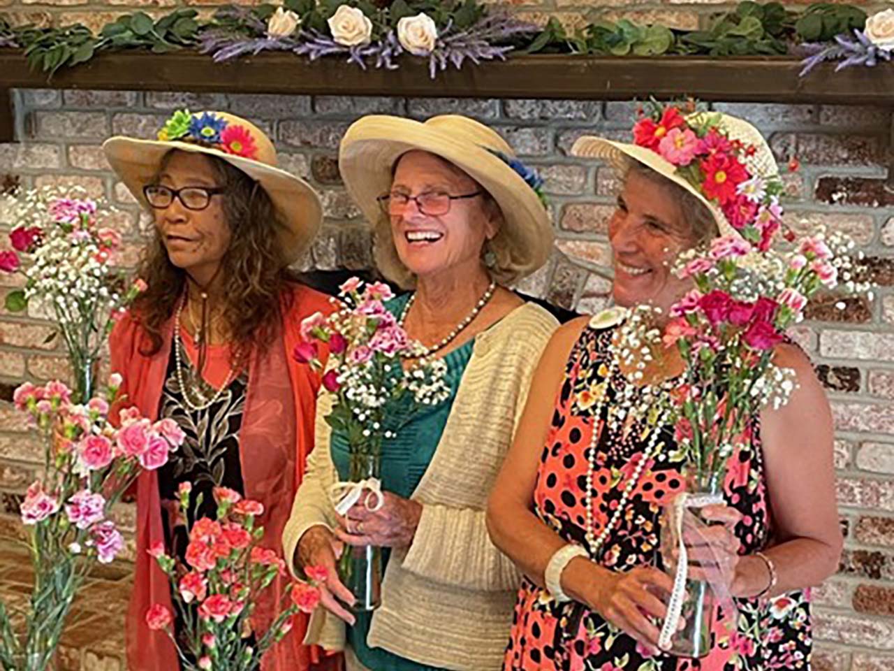 Moms in fancy hats with lots of flowers