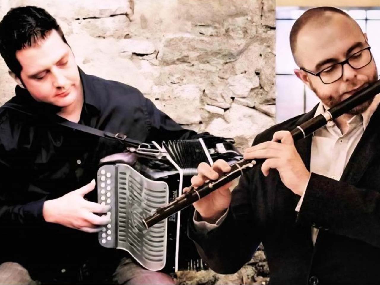 Men playing an accordion and a flute