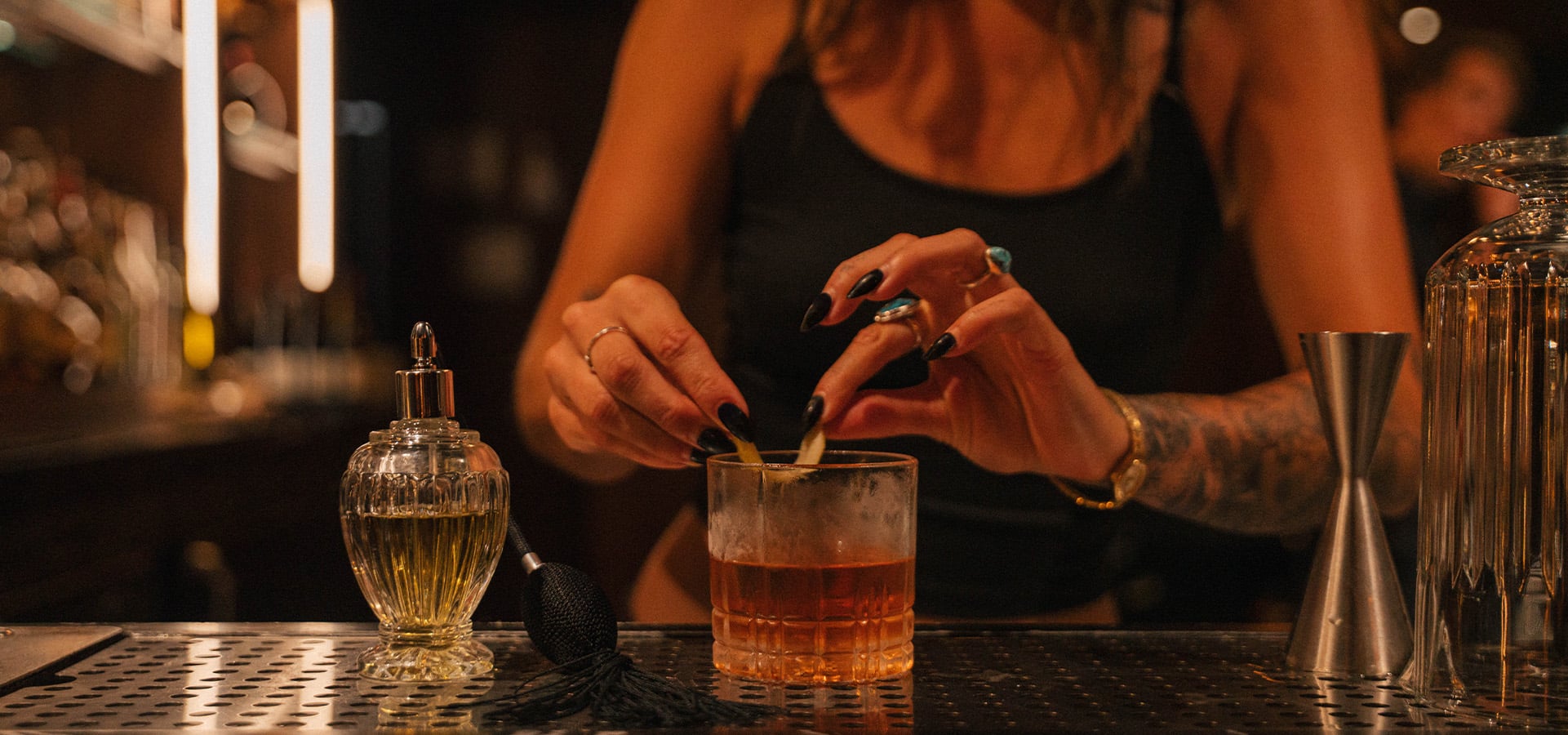 Bartender putting the finishing touches on a cocktail at Alley Oop. Photographed by Liz Birnbaum, The Curated Feast