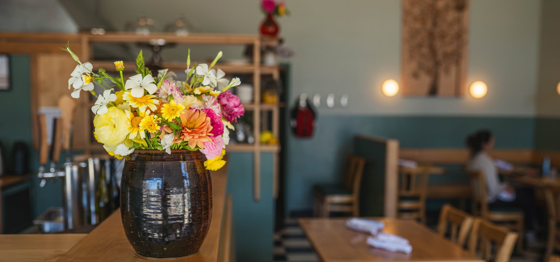 Bouquet of flowers on the counter of Midway Restaurant. Photographed by Liz Birnbaum, the Curated Feast