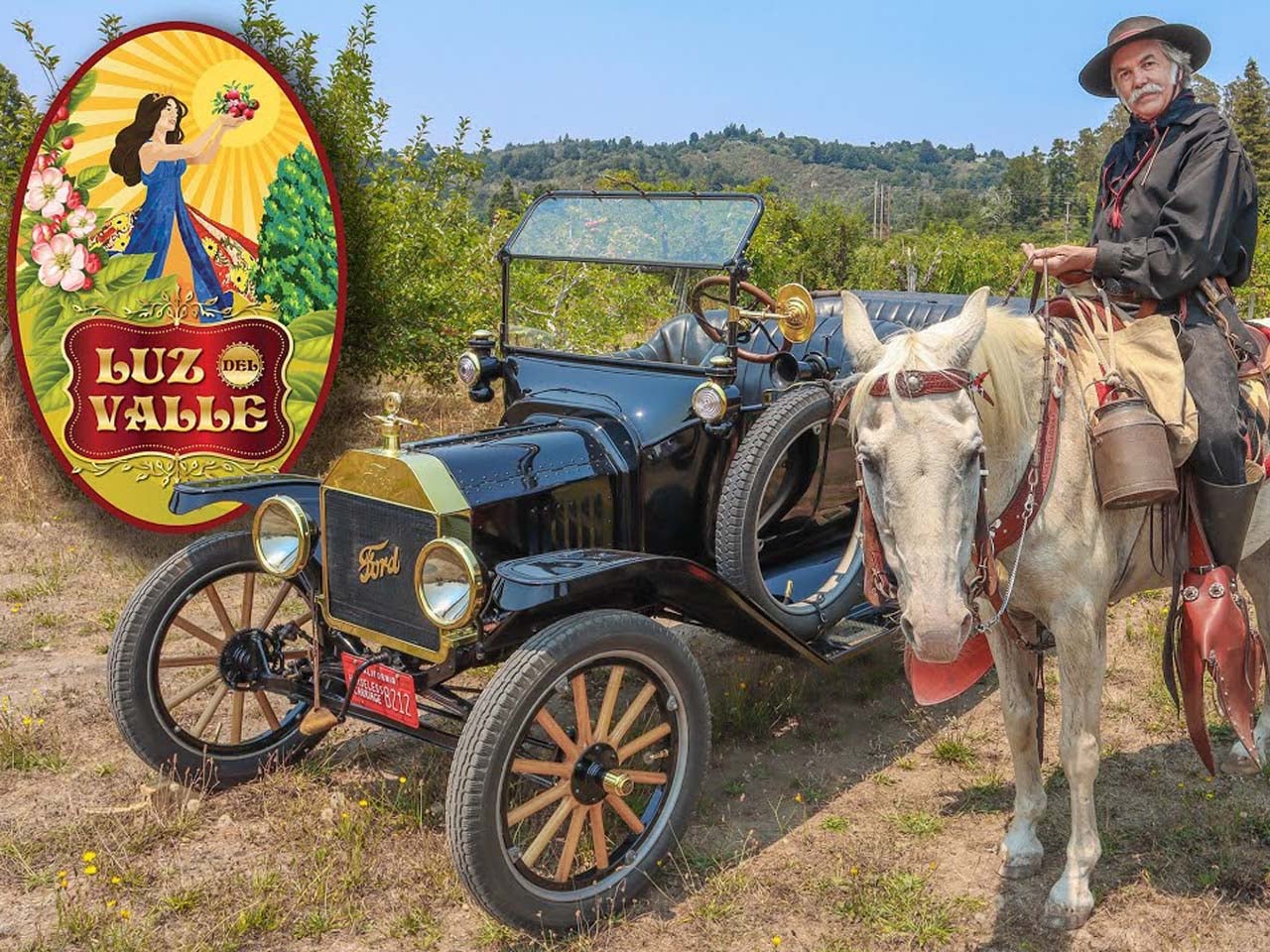 An old Vaquero in front of a model T in an apple orchard