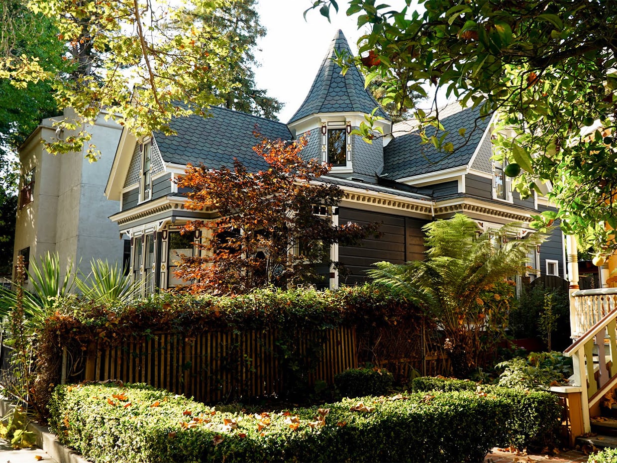 Victorian home surrounded by autumn colors. Photographed by Caryn Hewlett