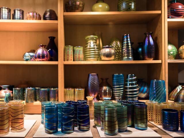 Studio of a glass blower; shelves of completed items
